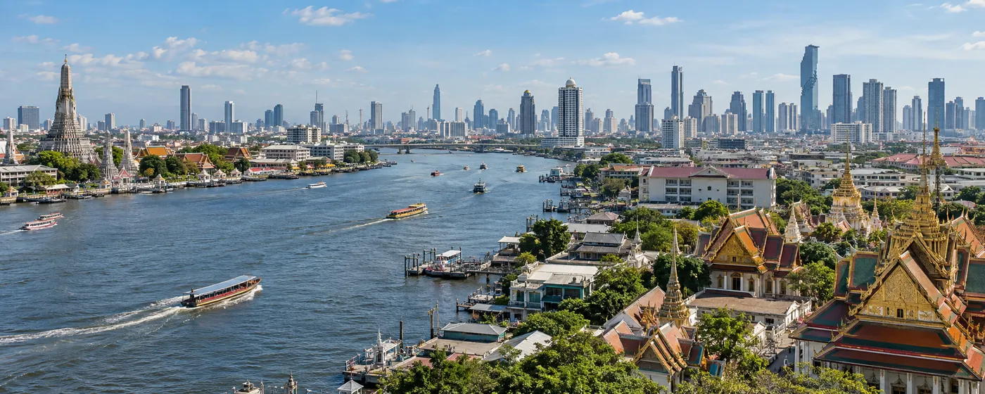 Bangkok’s skyline above the Chao Phraya, the temples of the old city along the river