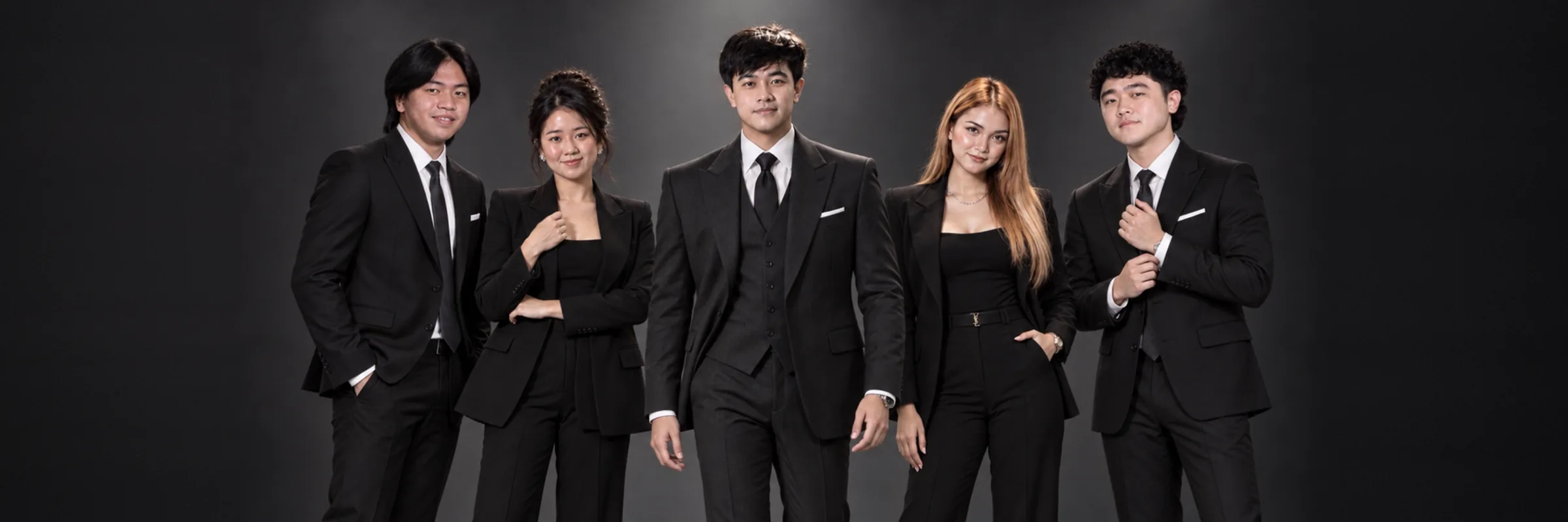 The A.D. team: five advisors in black suits against a dark studio backdrop
