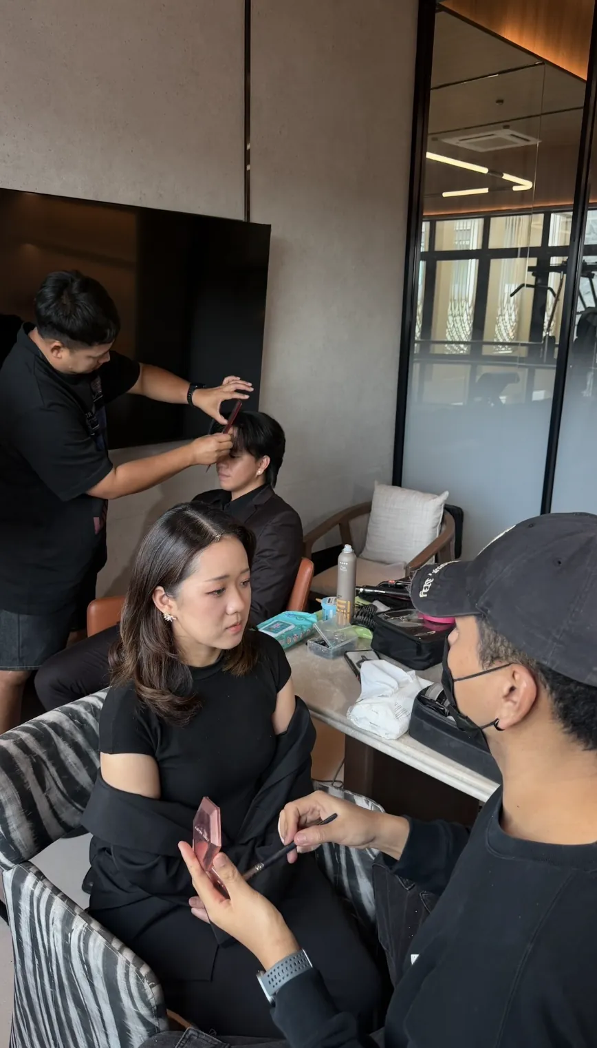 An A.D. advisor in hair and makeup before a property shoot