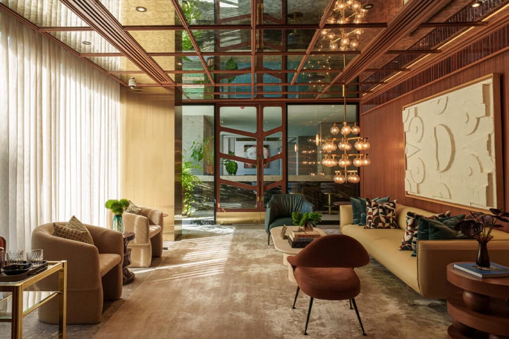 Developer-supplied image of a VIA 34 lounge with seating, art and a reflective ceiling