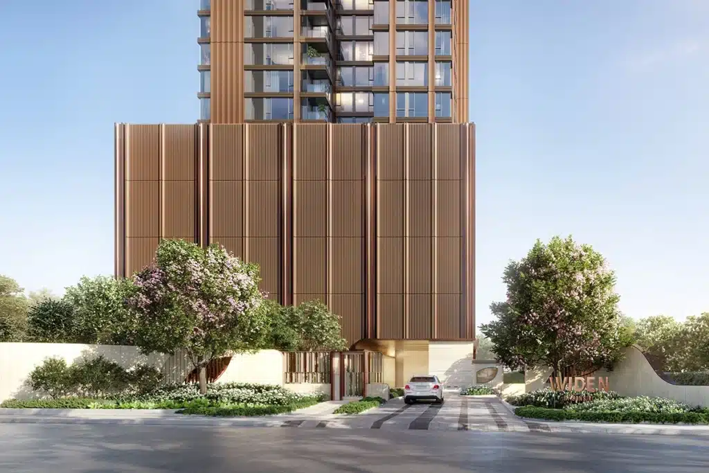 Developer rendering of the WIDEN entrance with vertical screens, a driveway and flowering trees