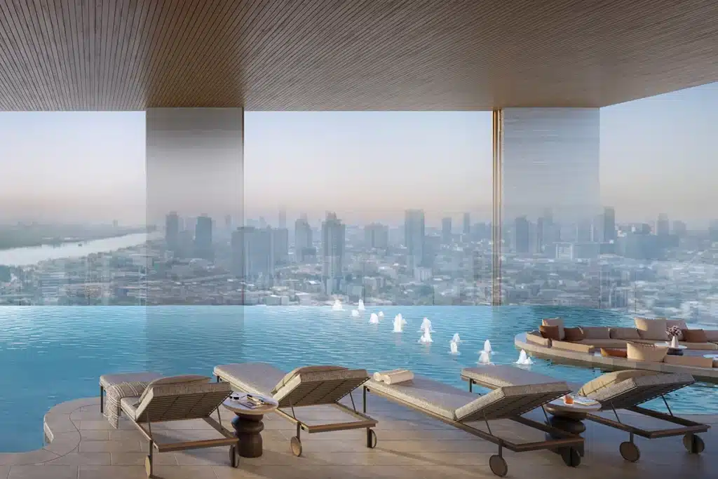 Developer rendering of the WIDEN pool area with loungers beneath a ceiling and a city backdrop
